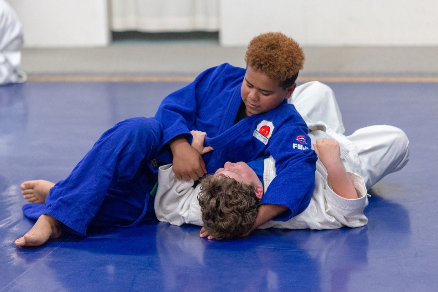 Two students practising a groundwork pin